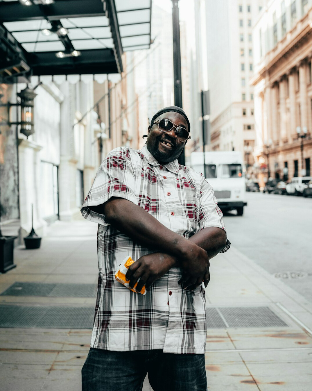 Portrait of a Black British man in his thirties wearing a casual shirt